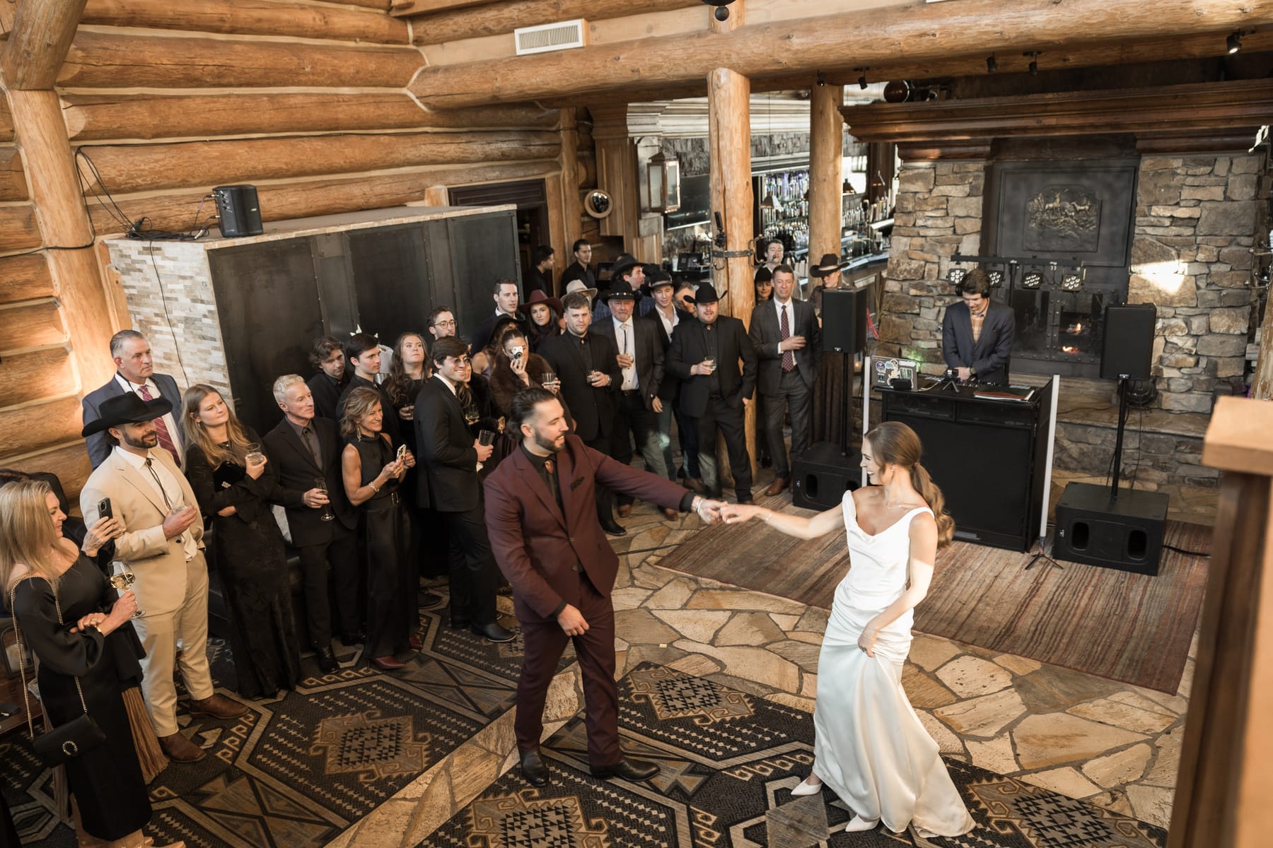First dance in the great room at Mountain Lodge Telluride, guests circled around the couple